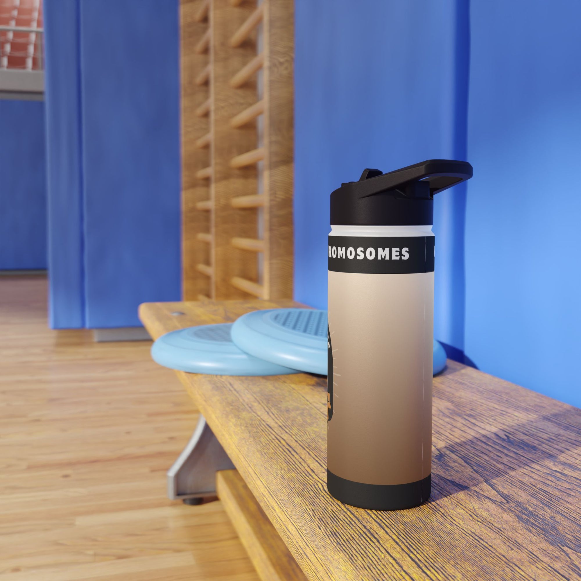 Water bottle with "ROMOSOMES" text on a wooden bench with blue curtains behind.